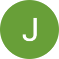 A green circle with a white J in the middle