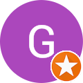 A purple circle with a white G in the middle